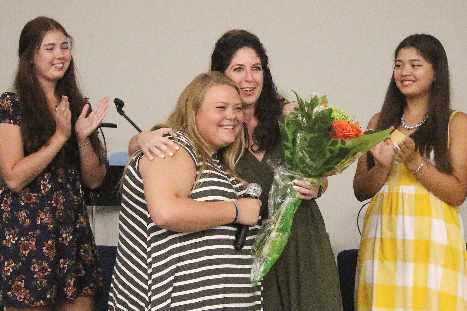Katie Mahnken received flowers for her dedication to the girls. She is a Program Coordinator with The Greatest Exchange and lives in Kazakhstan for six months each year to find young women to participate in the program.